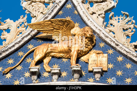 Closeup of statue of winged lion of Venice on roof of St Marks Basilica, Venice Stock Photo