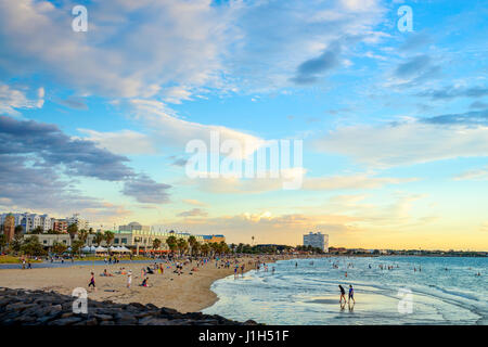 Melbourne, Australia - December 28, 2016: People spending time on St. Kilda Beach at sunset on a hot summer day, Victoria, Australia Stock Photo