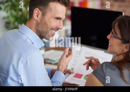 Rear view of discussing business partners Stock Photo