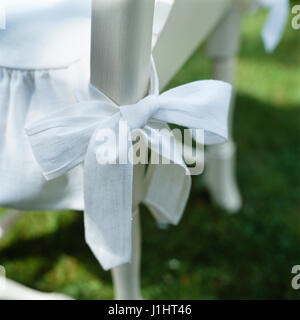 White seat cushion tied to chair. Stock Photo