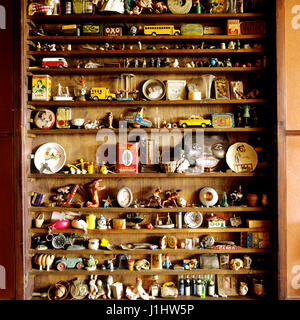 Shelf full of antique collectables.