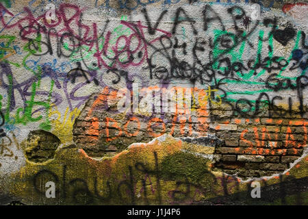 Graffiti on the rear brick and stucco wall of a building, Brasov, Romania, Eastern Europe Stock Photo