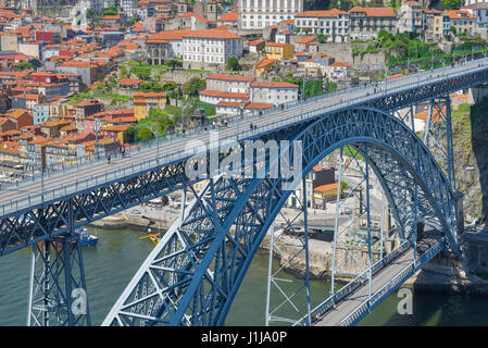 Porto Portugal bridge, view of people walking across the upper level of the Dom Luis bridge spanning the Douro River in the centre of Porto, Portugal. Stock Photo