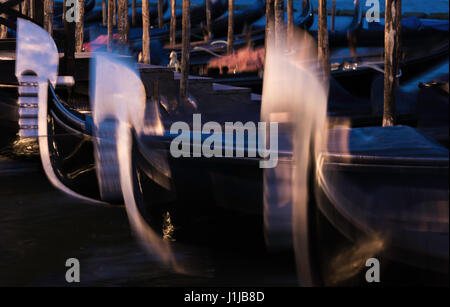 Long exposure at night of Venetian gondolas moored on Grand Canal at San Marco, Venice, Italy Stock Photo