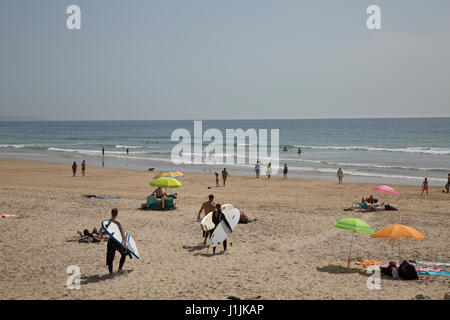 Surfers walking on Cascais beach, near Lisbon , Portugal. Stock Photo