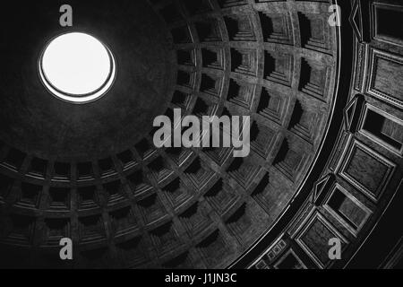 Inside view of the oculus (hole) and dome of the Pantheon in Rome in black and white. Stock Photo