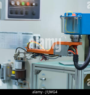 Automatic robot in assembly line working in factory. Smart factory industry 4.0 concept. Stock Photo