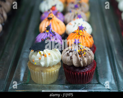 Close up of fancy halloween cupcakes with bat on top Stock Photo