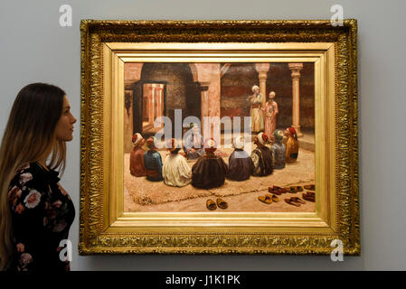 London, UK.  21 April 2017.  A staff member views 'The Dhikr' by Eugène Baugniès, (est. GBP 80-120k), at a preview at Sotheby's, New Bond Street, of upcoming sales of Arts of the Islamic World, 20th century Middle East Art and Orientalist art.  Credit: Stephen Chung / Alamy Live News Stock Photo