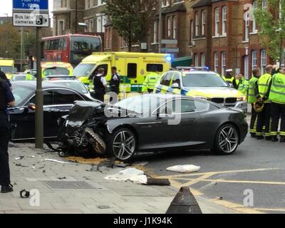 Battersea, London, UK. 22nd Apr, 2017. A crash involving a Sports Jaguar, Mercedes Saloon and moped occurred, Saturday 22 April, 2017 at approximately 9AM on Queenstown Road in Battersea.  The moped driver was seriously injured. Emergency services attended including police, police helicopter, London Ambulance Service. Police are still investigating. Queenstown Road is still closed in both directions. Credit: Emmett Hayes/Alamy Live News Stock Photo