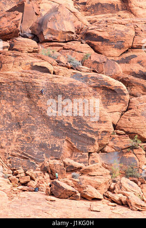 Red Rock Canyon, NV - October 27, 2016:  Climbers scaling a rock face at Red Rock Canyon National Conservation Area.  The national park is a popular t Stock Photo