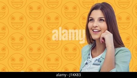 Digital composite of Woman hand on head against yellow emoji pattern Stock Photo