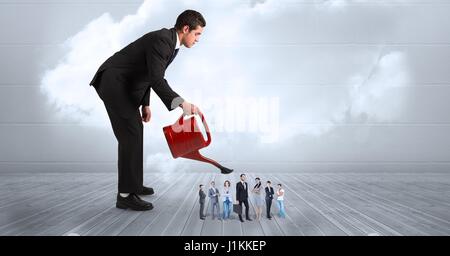 Digital composite of Digital composite image of businessman watering colleagues on boardwalk Stock Photo