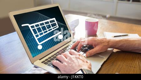 Digital composite of Businessman shopping online using laptop Stock Photo