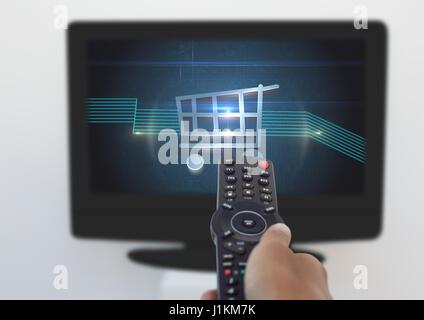 Digital composite of Person using Tv Remote with Shopping trolley icon Stock Photo