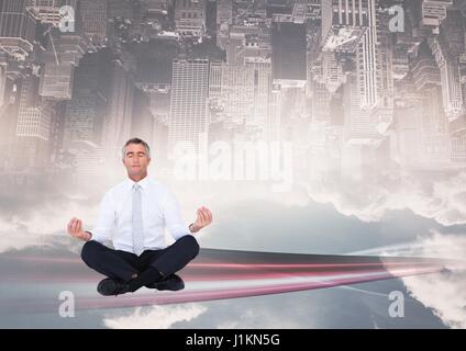 Digital composite of up side down city. meditating under the city Stock Photo