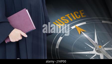 Digital composite of Judge holding book in front of justice text and compass Stock Photo