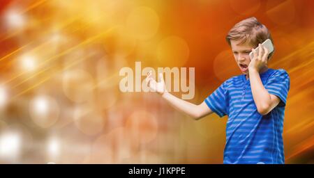 Digital composite of Angry boy using smart phone while gesturing over bokeh Stock Photo