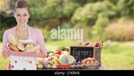 Digital composite of house chef with bread basket in the farm selling their products Stock Photo
