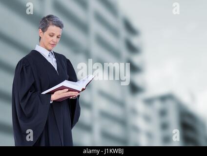 Digital composite of Judge holding book in front of buildings Stock Photo