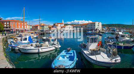 Izola, Slovenia, April 17, 2017: 44MP large panorama of Izola old fishing harbor with traditional fishing boats and old medieval town centre in backgr Stock Photo