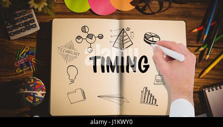 Digital composite of Timing graphic on a notebook. hand drawing it Stock Photo