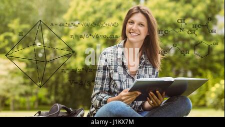 Digital composite of Digital composite image of math equation with smiling female college student in background Stock Photo