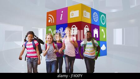 Digital composite of Smiling school children running against apps icons Stock Photo