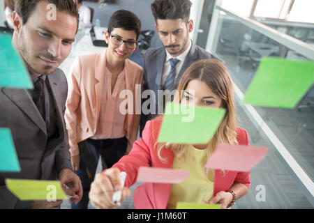 Colleagues brainstorming using adhesive notes Stock Photo