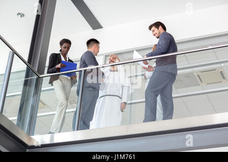 Young business people in hall of company Stock Photo