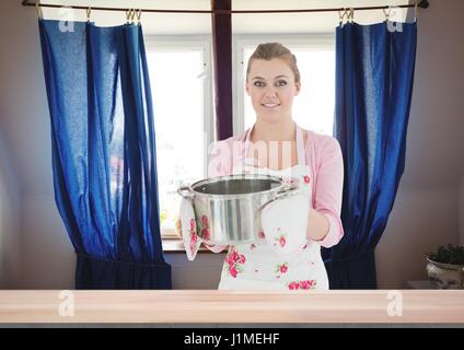 Digital composite of Housewife with saucepan Stock Photo