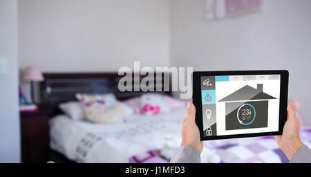 Digital composite of hands using application of smart home on digital tablet Stock Photo