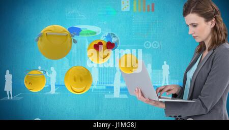 Digital composite of Digital composite image of businesswoman using laptop by various emojis Stock Photo