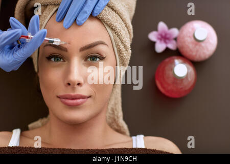 Beauty woman giving botox injections. botox, cosmetic treatments, wrinkle removal, Botox injections Stock Photo