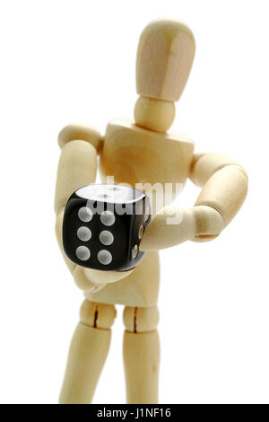 Wooden manikin and dice Stock Photo