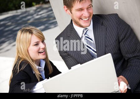 Two caucasian business people having a discussion Stock Photo