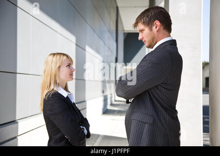 Two caucasian business people looking at each other angrily Stock Photo