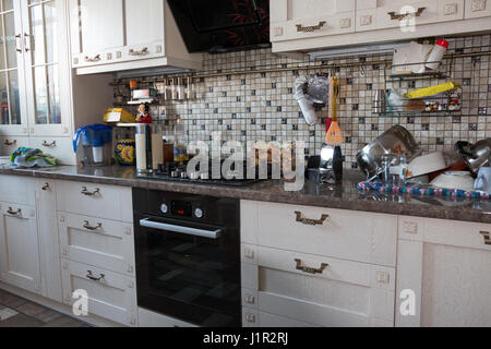 kitchen furniture, kitchen utensils and gas appliances in the apartment Stock Photo