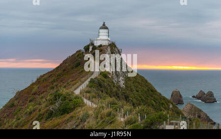 Sunrise, Lighthouse at Nugget Point, The Catlins, Otago Region, Southland, New Zealand Stock Photo