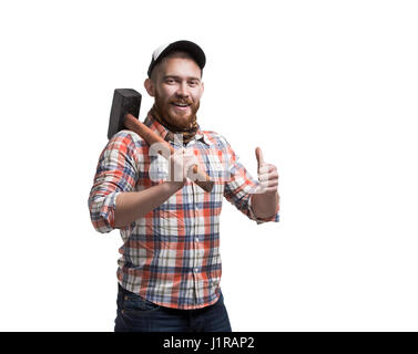 Redhead Bearded man wearing a baseball cap and shirt holding a hammer with an expression. Thumbs Up. Smile. Stock Photo