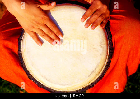 Young lady drummer with her djembe drum Stock Photo