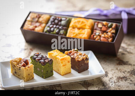 Sweet cake with beans on white platter Stock Photo
