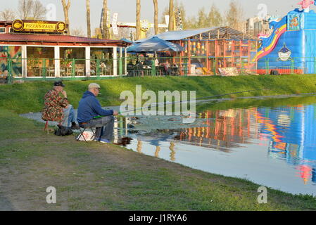 ST.PETERSBURG, RUSSIA - MAY 03, 2016: Fishermen catch fish in the pond of the Park of Victory in Saint-Petersburg Stock Photo