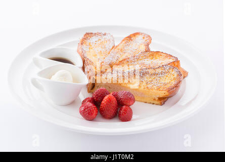 Grilled bread in heart shape with strawberry and cream Stock Photo