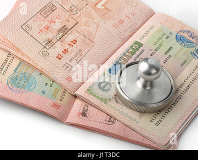 Close up of open passports with visa stamps Stock Photo