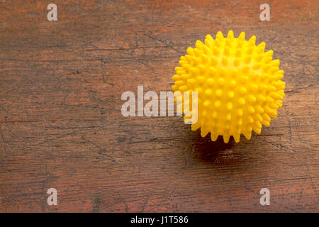 spiky rubber  ball roller for self massage, reflexology and myofascial release Stock Photo