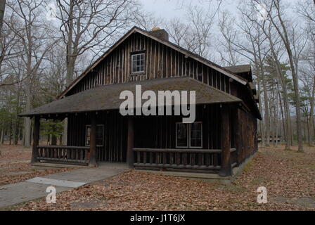 old log cabin dark brown in wilderness Stock Photo