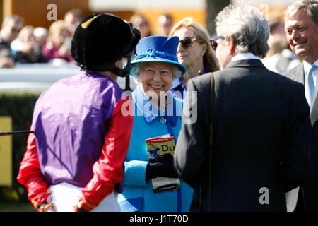 Queen Elizabeth II talks to jockey Ryan Moore before the Dubai Duty Free Tennis Championships Maiden Stakes during day two of the Dubai Duty Free Spring Trials & Beer Festival at Newbury Racecourse. Stock Photo