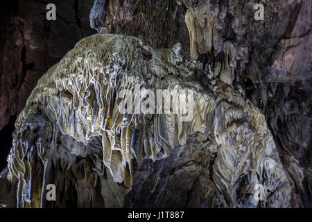 Flowstone / cave draperies, sheetlike deposits of calcite suspended from ceiling in the Caves of Han-sur-Lesse / Grottes de Han, Ardennes, Belgium Stock Photo