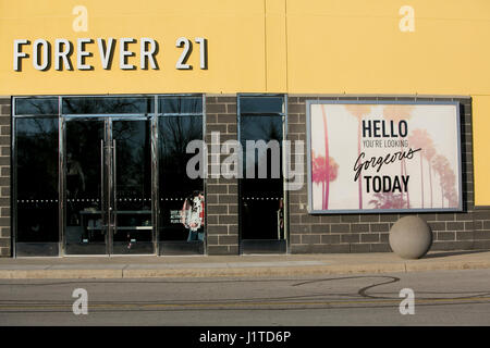 A logo sign outside of a Forever 21 retail store in Burlington, ON, Canada on April 14, 2017. Stock Photo